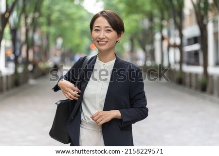 Beautiful Japanese wearing a jacket Royalty-Free Stock Photo #2158229571