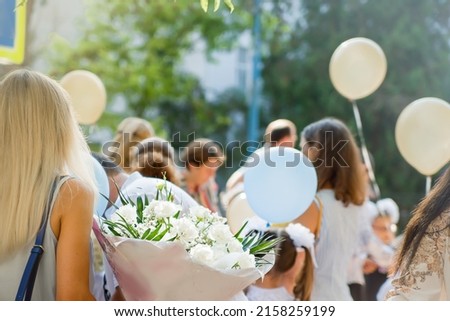 End of school, May spring, last call. Holiday in the school yard - School leavers celebrate the 'Day of Farewell Bell' dedicated to graduation from school. graduates 2022 Royalty-Free Stock Photo #2158259199