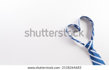 Happy Fathers Day background concept made from necktie with heart shape on white background. Royalty-Free Stock Photo #2158264683