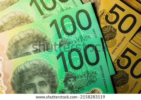 Close up macro shallow depth of field $50 and $100 AUD Australian fifty dollar and hundred banknote or Aussie currency