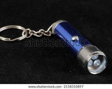 One Blue Aluminum Led Torch on a Black Background