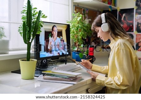 Teenage female student studying online at home Royalty-Free Stock Photo #2158324425