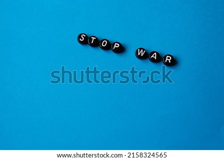Stop war in Ukraine. Stop war. Concept of stop ongoing conflicts in the world. isolated Blue background. Copy space.