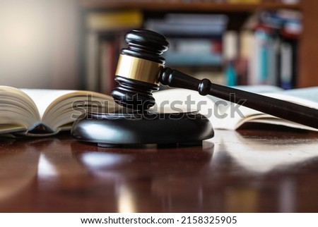 Judge's gavel and wooden block used in trials and auctions Royalty-Free Stock Photo #2158325905