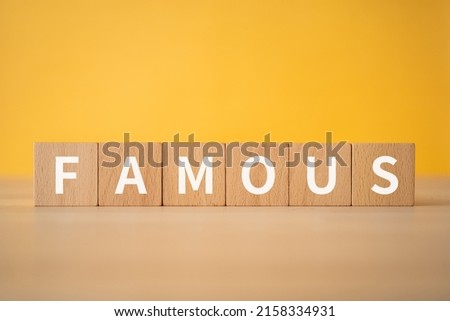 Wooden blocks with "FAMOUS" text of concept. Royalty-Free Stock Photo #2158334931