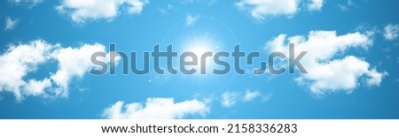 Panoramic sunny sky background extra wide banner. Tiny white clouds. 3d ceiling decoration image. Sky bottom up view.