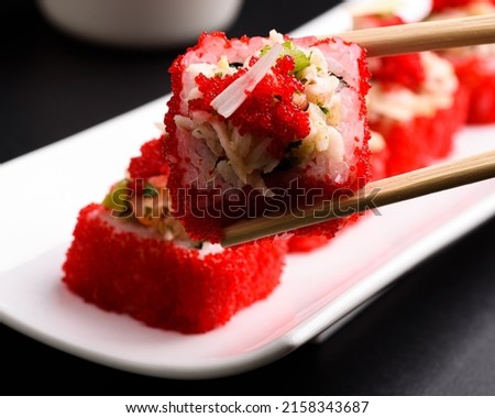 Traditional asian Japanese food  Fresh Sushi rolls on dark and black background