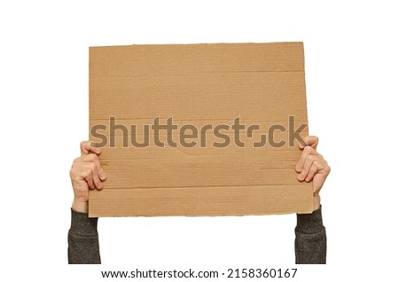 Posters of cardboard in his hands. Isolated on white. Copy space.