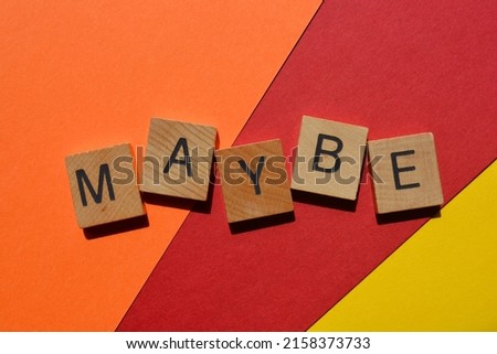Maybe, word in wooden alphabet letters isolated on bright and colourful background