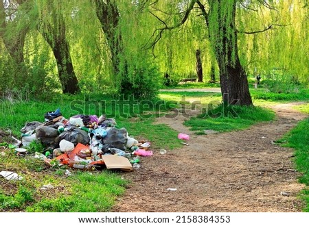 pile of rubbish in the forest. Royalty-Free Stock Photo #2158384353
