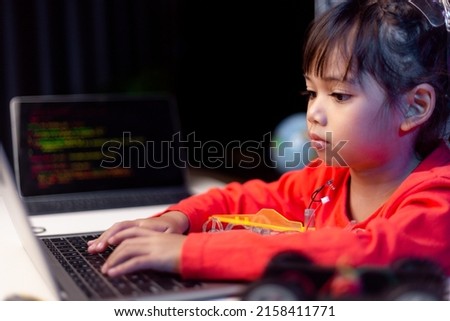 Asia students learn at home in coding robot cars and electronic board cables in STEM, STEAM, mathematics engineering science technology computer code in robotics for kids concept. Royalty-Free Stock Photo #2158411771