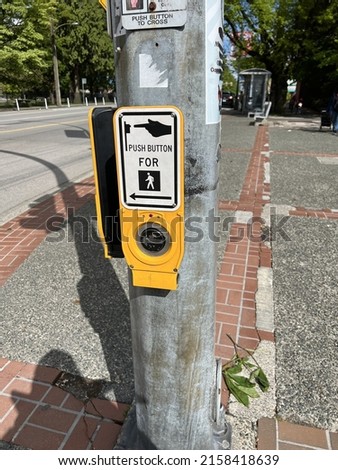 A picture of a walk sign  outside on a pole