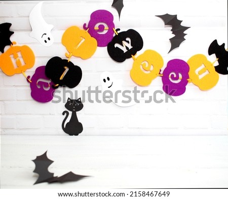 Halloween holiday concept with jack pumpkin decor on wooden table. Copy space