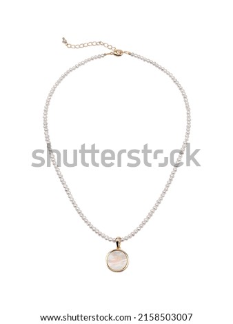 Pearl golden necklace with white round pendant isolated on white backround. Top view  Royalty-Free Stock Photo #2158503007