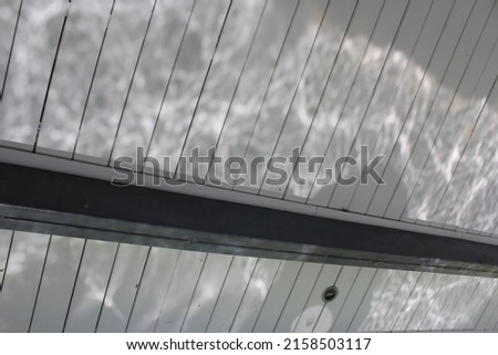 The watermark hits the ceiling fabric.