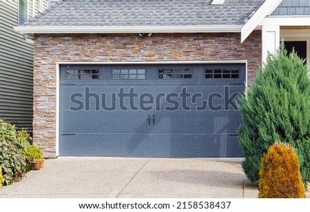 Garage door in a luxury house. Garage door in Vancouver, Canada. Street photo, nobody, selective focus