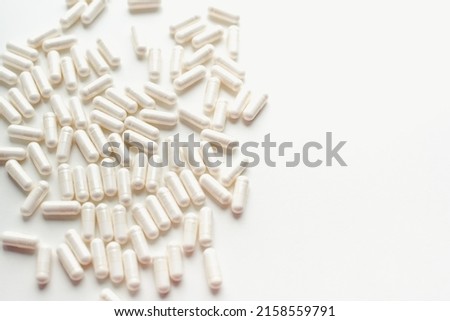 Pill capsules on a white background. Vitamins on a white background. Royalty-Free Stock Photo #2158559791