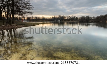 An evening view with reflections in the Silbersee, Germany, Lower Saxony, Hanover, Langenhagen