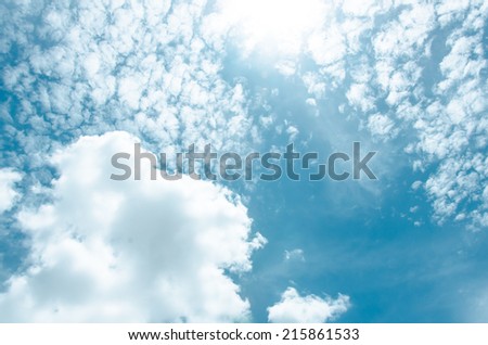 Blue sky with sun and cloud