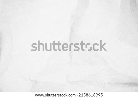 Crumpled white paper texture background for various purposes. atural recycled paper or paperwork closeup newspaper of wrinkle texture shiny work sheet. Have art light tone grey and white wallpaper.
