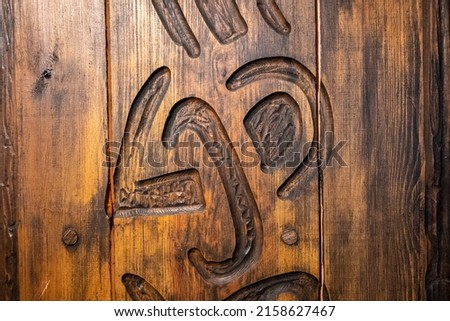 A closeup of wood carvings with special symbols