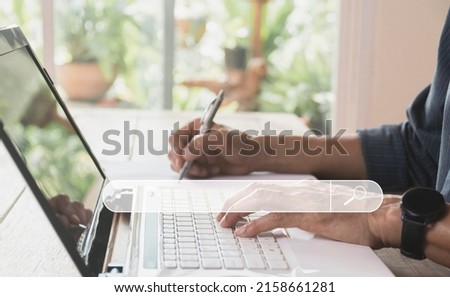 Business man searching and working with computer laptop on table at home. Working online business concept.