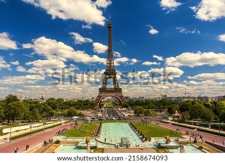 A stunning view of The Eiffel Tower in Paris, France with cloudy sky background