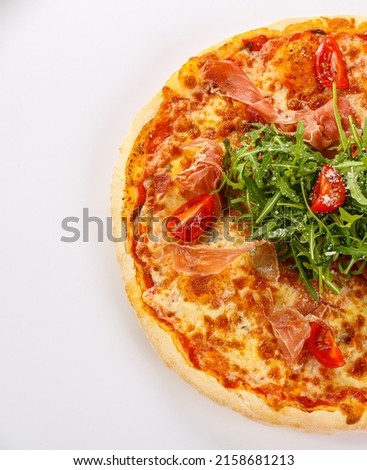 Pizza with parma, cheese and rucola