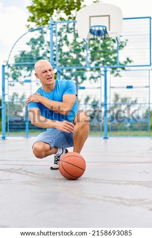 man at sports has problems pain with health on the basketball court