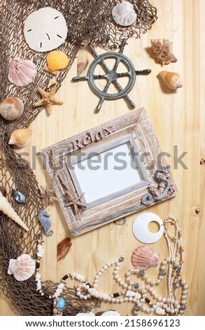 Empty Frame on Wooden Background With Sea Shells and Fishing Net. Nautical and Coastal Theme 