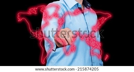 Businessman pointing on a glossy world map.