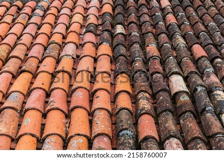 A closeup of the old weathered  roof tiles 