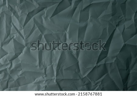 crumpled paper. sheet of paper Dark Jungle Green and Outer Space Slate colors. detailed high resolution texture. abstract background for wallpaper.