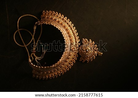 Indian Traditional Jewellery. Top view of Necklace on black background. selective focus Royalty-Free Stock Photo #2158777615