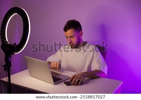 Online education, man using laptop with ring lamp