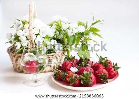 Ripe red strawberries on a plate. Summer harvest