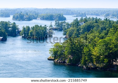 Rocky islands in the Thousand Islands region in Ontario Royalty-Free Stock Photo #215885749