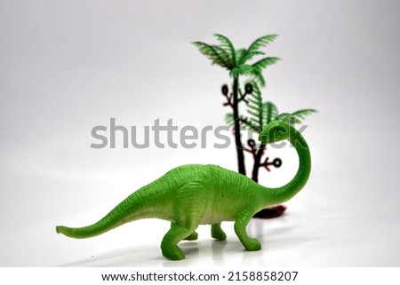 dinosaur miniature toy on a white background