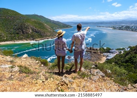 A panoramic view of the lagoon of Knysna, South Africa. beach in Knysna, Western Cape, South Africa. couple man and woman on a trip at the garden route  Royalty-Free Stock Photo #2158885497
