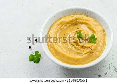 Vegetarian split pea soup puree with herbs and olive oil. Top view, copy space, flat lay. Royalty-Free Stock Photo #2158910551