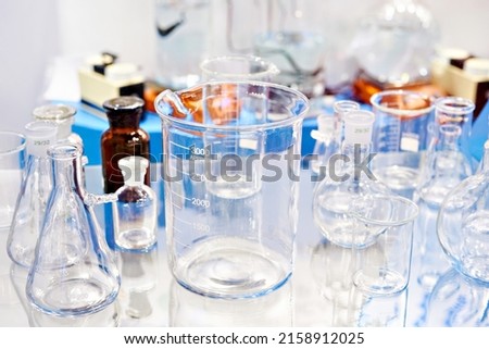 Laboratory glass dishes, bottles, jars and flasks in store