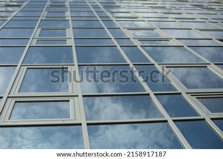 Mirror building. Reflection in windows. Modern architecture. Office building.