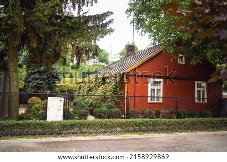 An exterior of a red wooden house in Potoki street Warsaw  Royalty-Free Stock Photo #2158929869