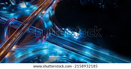 Aerial view of car traffic transportation above circle roundabout road of Drone aerial view fly , high angle. Public transport or commuter city life concept of economic and energy, infrastructure	 Royalty-Free Stock Photo #2158932185