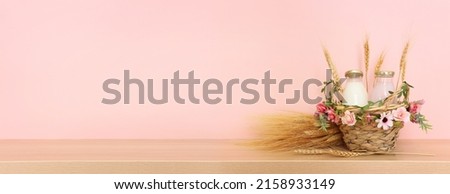 Photo of dairy products over wooden table. Symbols of jewish holiday - Shavuot Royalty-Free Stock Photo #2158933149