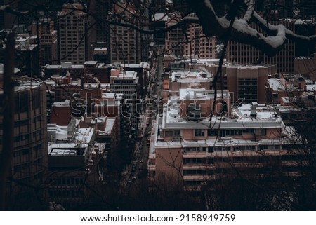 An aerial view of old urban buildings against sky with sunlight morning in Montreal, Canada