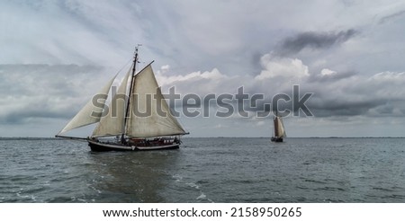 A beautiful view of the classic sailing vessel in Dutch waters during the wind, Netherlands Royalty-Free Stock Photo #2158950265