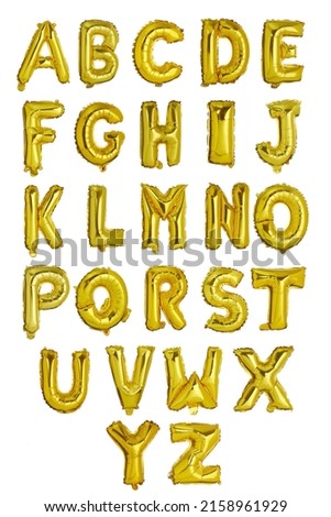 A picture of an english alphabet made of gold inflatable helium balloons. The gold letter-shaped balloons set is isolated on a white background. Front view.