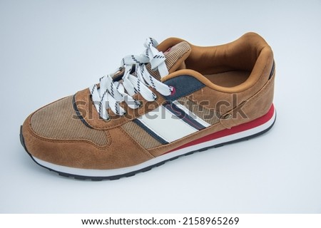 new brown sneakers on white background