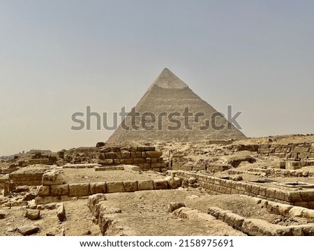 The Great Pyramid of Giza is the largest Egyptian pyramid and tomb of the Fourth Dynasty pharaoh Khufu. Built in the 26th century BC, it is the oldest of the Seven Wonders of the Ancient World. Royalty-Free Stock Photo #2158975691